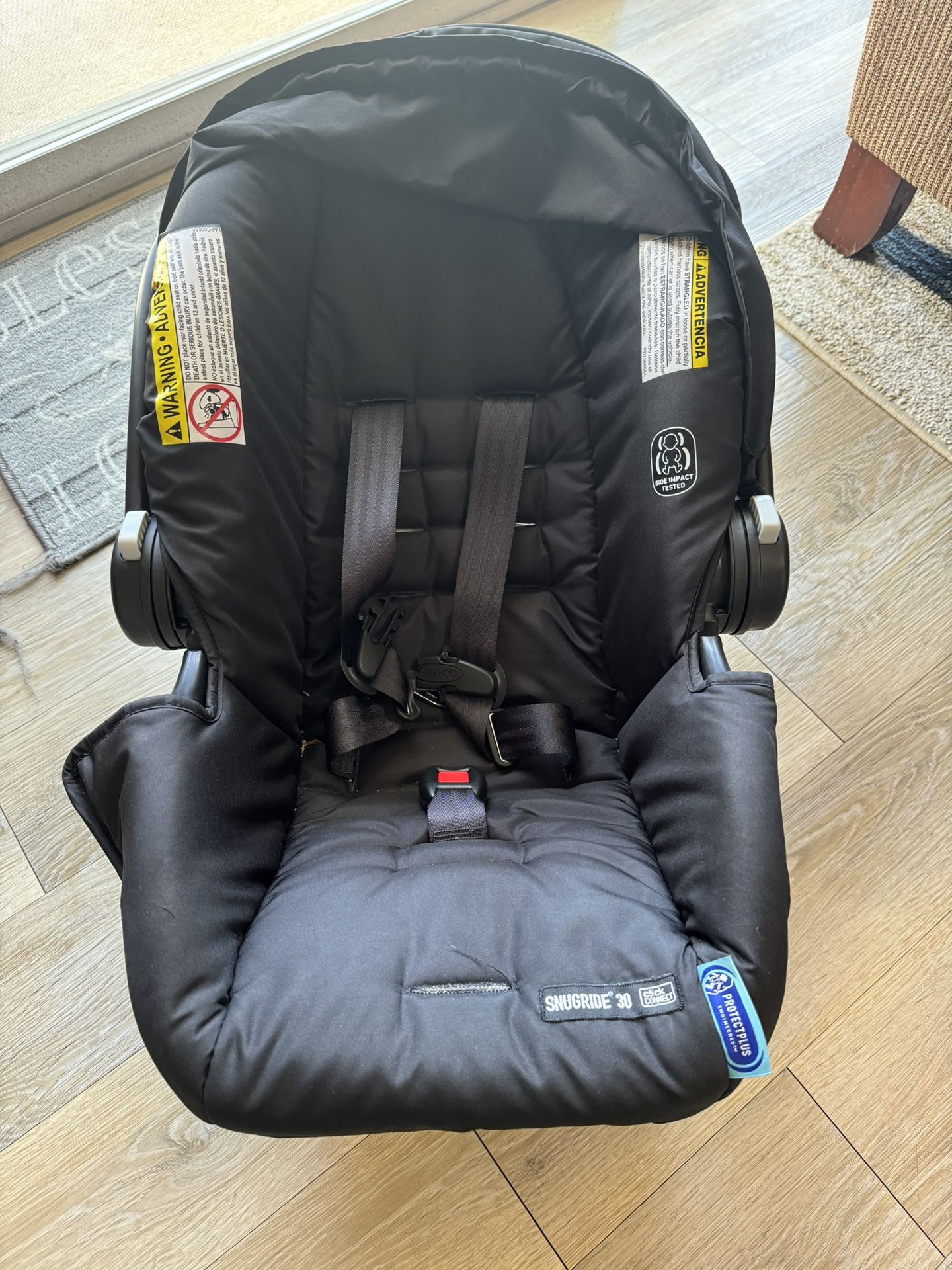 Infant Graco Car seat and Walker With Toys In Great Condition 