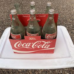 Antique collectible vintage old Coca Cola bottles with carry case circa 1970s