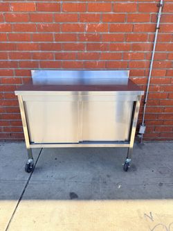 Enclosed 24” x 47” Stainless steel with sliding doors