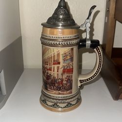 Ceramic German beer stein with metal lid