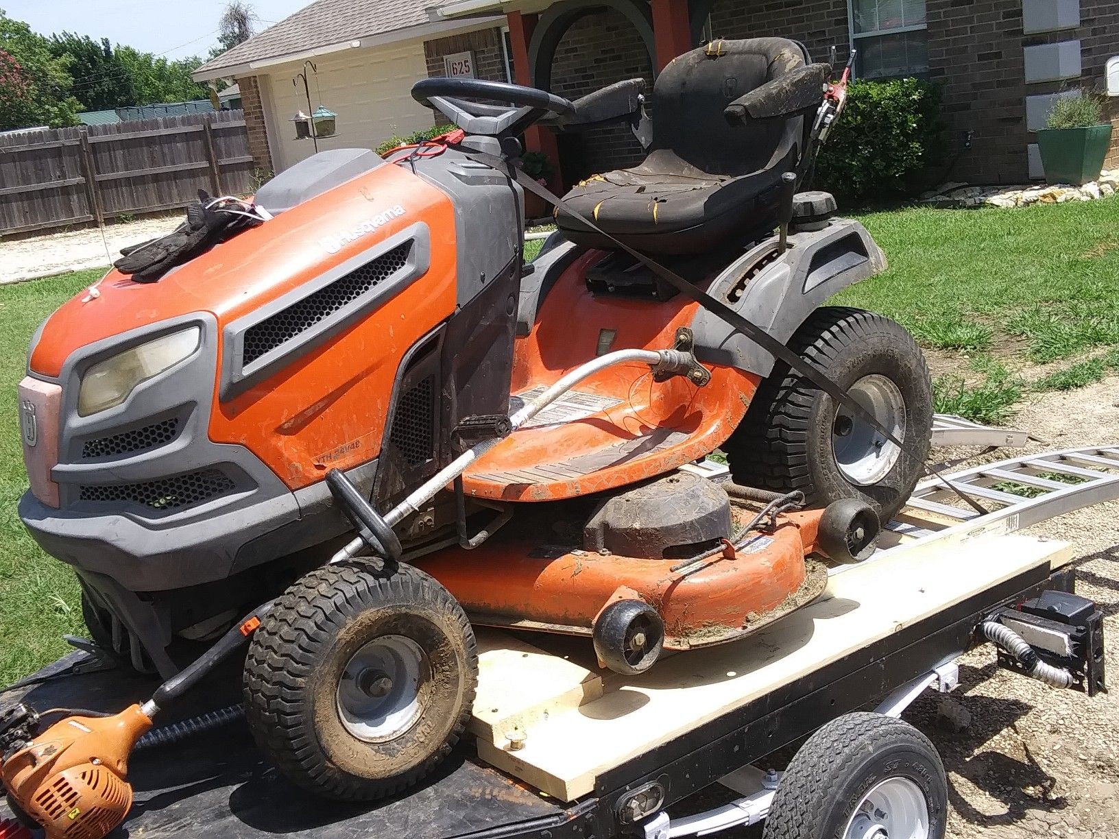 Huskabarna riding lawn mower trailor and weed eater and blower