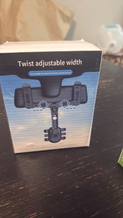 Rear view mirror phone holder
