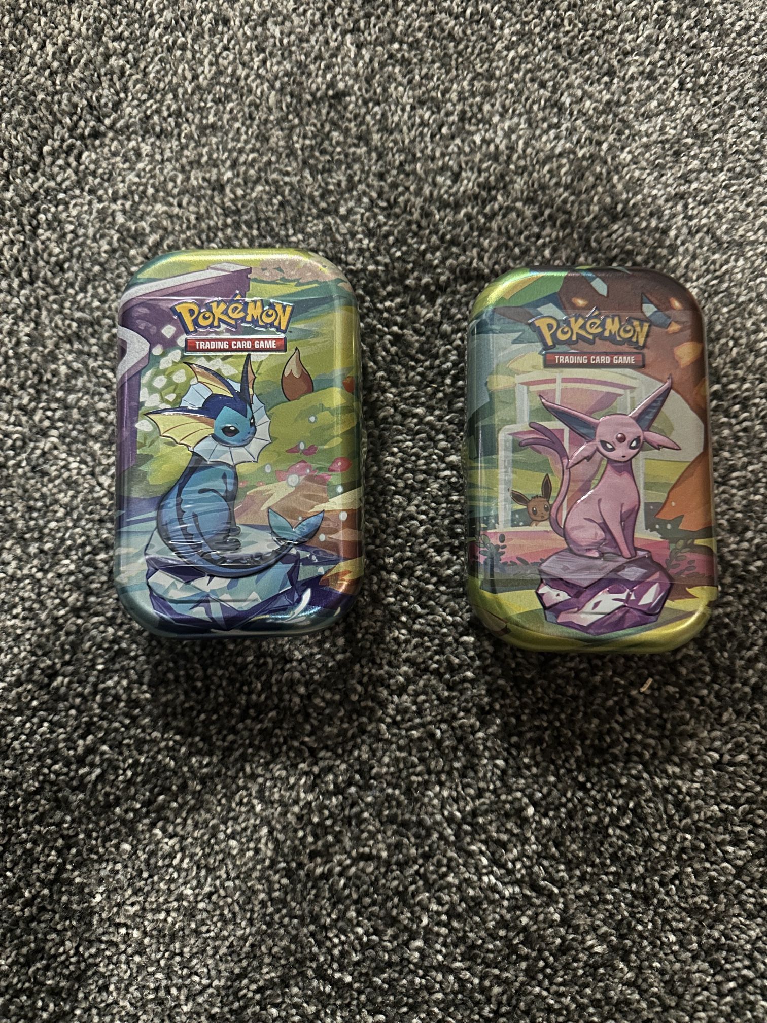 Prismatic Evolution Tins