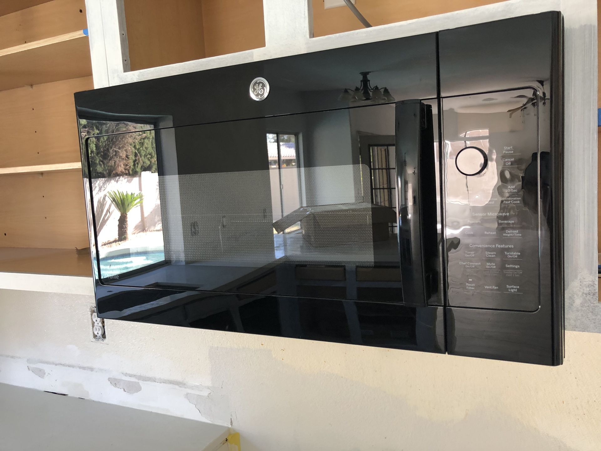 Black GE Built-In Microwave, Black GE Refrigerator, Black Kenmore Electric Oven