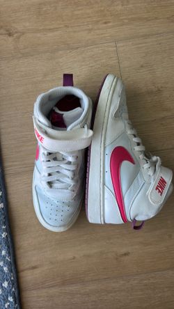White and pink Nike high tops