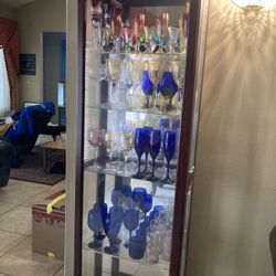 Selection Of Beautiful Glass Cups And Cabinet
