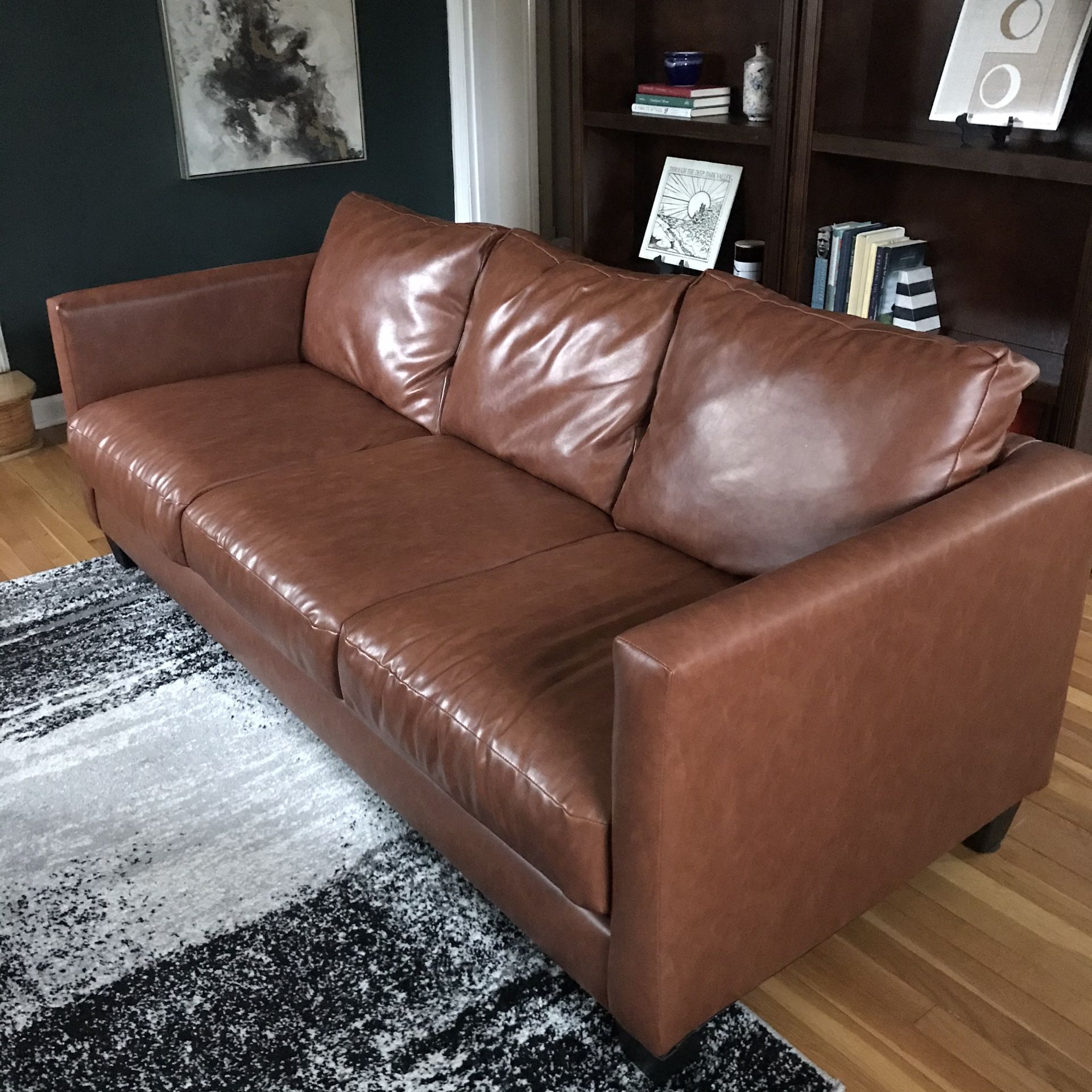 Tan faux leather couch <1yr old