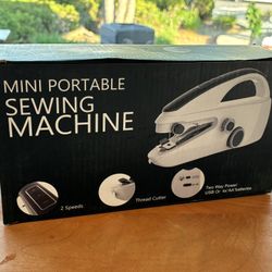 Mini sewing machine works with batteries or power cord