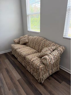 Couch with complementary ottoman