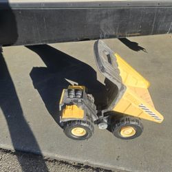 Tonka Classic Steel Mighty Dump Truck toy vehicle. 
It is made with a combination of steel and sturdy plastic for durability. 
The truck bed is articu