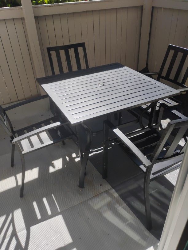 6-Piece Black Patio Table W/ 4 Chairs & Beige Umbrella