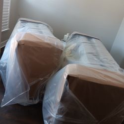 BRAND NEW COUCHES. STILL IN PLASTIC WRAP