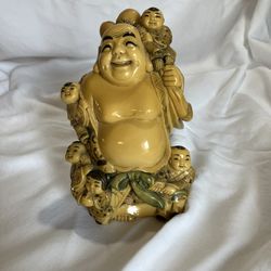 Laughing buddha with children