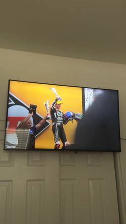 Flat Screen Wall-Mounted TV