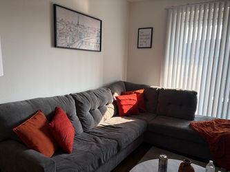 Dark grey L couch