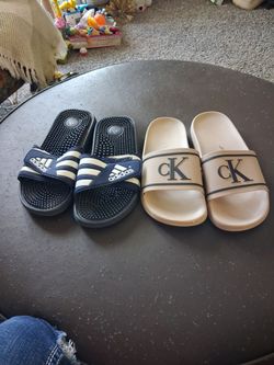 7-8 medium slides Calvin Klein and Adidas $25.00 for both or $15.00 individually