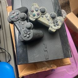 PlayStation 3 And 2 Controllers  And games 