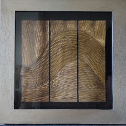 Golden Metal Wave Sculpture Within Large Frame