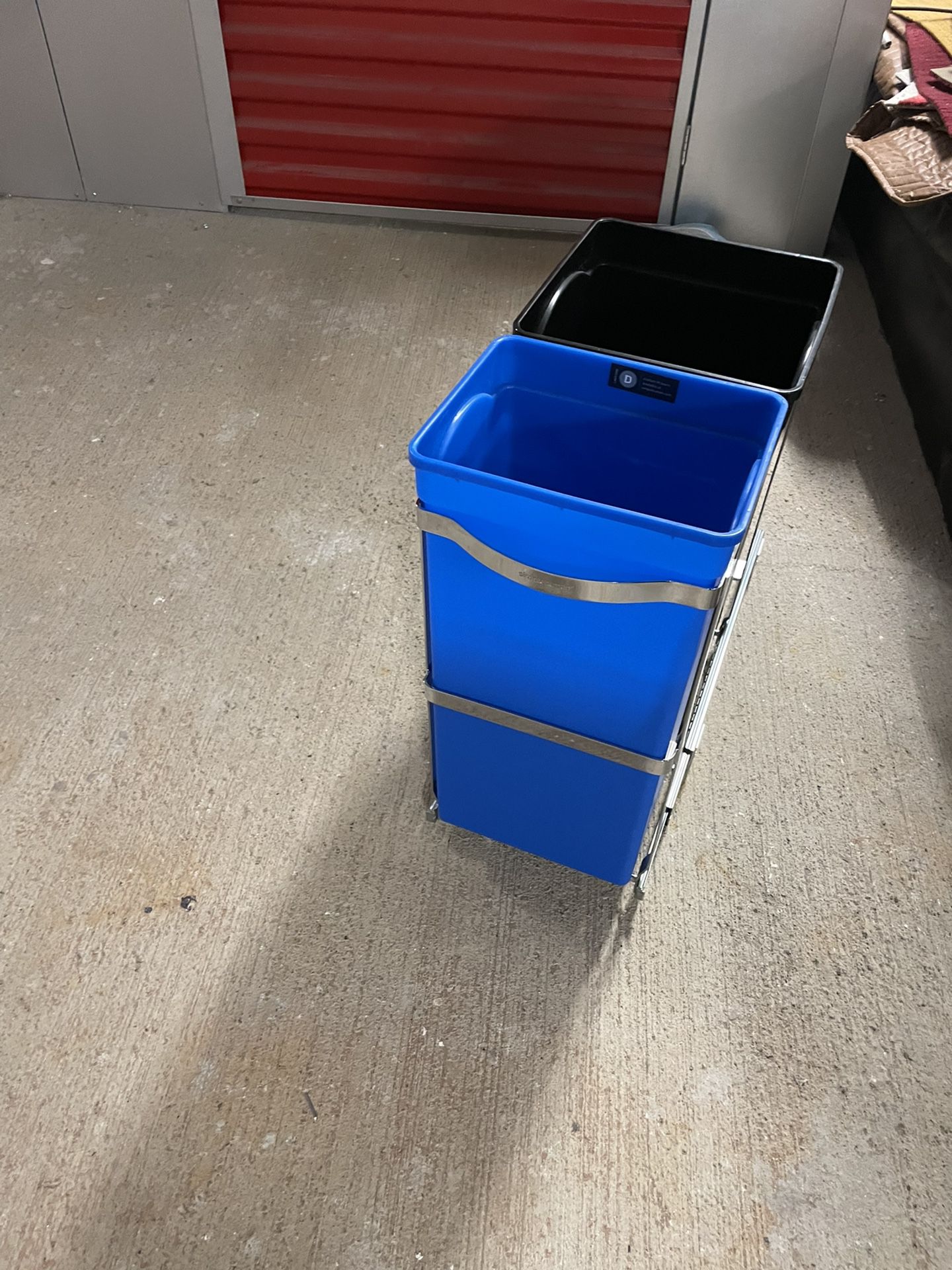 4 Trash can holders for under th sink. Slides out like a drawer.