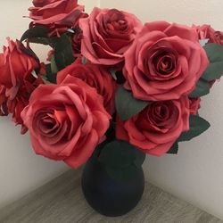 Plastic Vase With Red Flowers