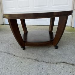 ROUND COFFEE TABLE On Castors. 