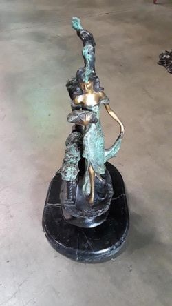 Bronze florist on a marble base