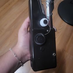 Handheld sewing machine