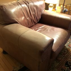 Salmon color leather chair & ottoman 