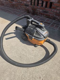 Rigid wet/dry vacuum