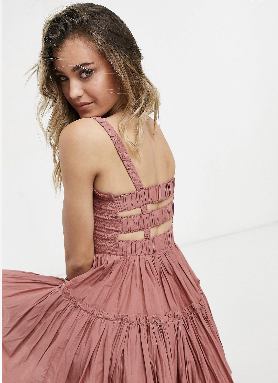 Mini sundress with raw edges in dusty pink. 
