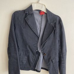This is a corduroy suit jacket (a corduroy mini suit" or "a corduroy suit jacket").   •	The fabric is corduroy, with a fine stripe texture; •	The silh