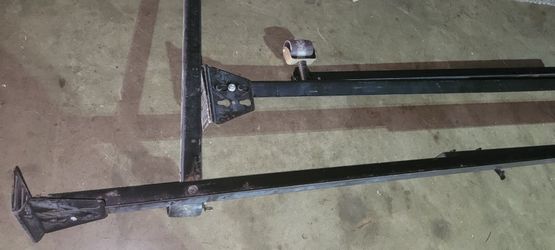 Twin bed frame with rollers.
