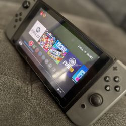 Nintendo Switch (Gen 1) + Extra Controller + Case