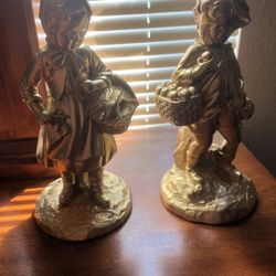 Boy and girl coming home from market statue set