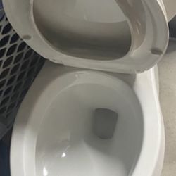 Elongated Toilet- New- Firm Price