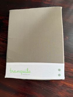Tranquilo Soothing Mat in a taupe/khaki cover, designed to vibrate and soothe babies
