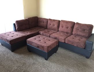 brand new reversible sectional sofa with drop down cup holders, and storage ottoman.