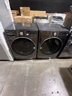 27” new Lg top load washer dryer electric stackble