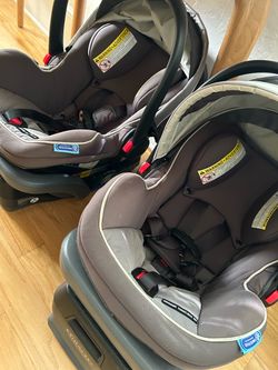 Two Graco infant car seats