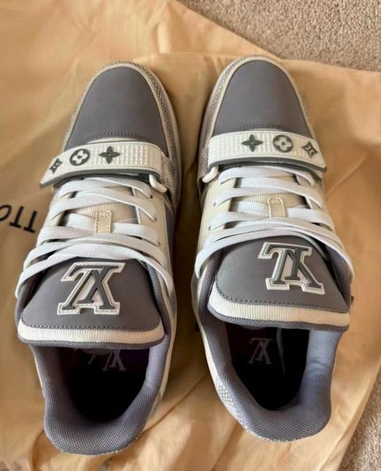 Louis Vuitton trainer with snake skin texture and Velcro fasteners
