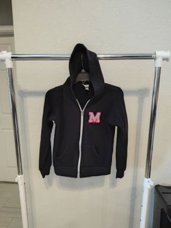 black full-zip hoodie,  glittered silver and white letter "M" patch on the left chest. and cheer Raiders, Melanie patch on the back, girls, size M