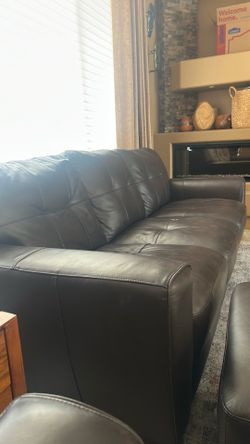 Leather sofa, two club chairs with matching ottomans.