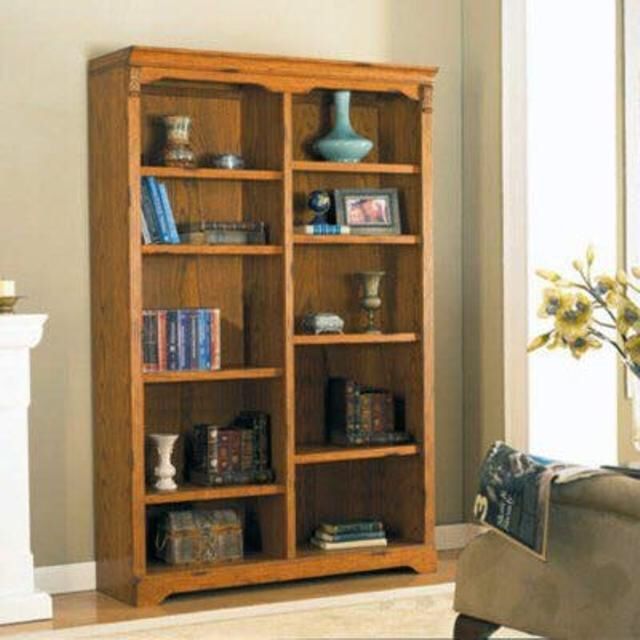 Whalen bookcase constructed of hardwood and oak veneers Features 8 adjustable shelves.