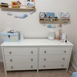 Sturdy white dresser with wooden knobs