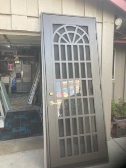 Gently used Titan door bronze in color