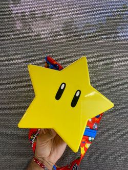Super Nintendo World Super Star popcorn bucket with lanyard.