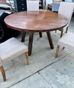 Round kitchen table with four chairs