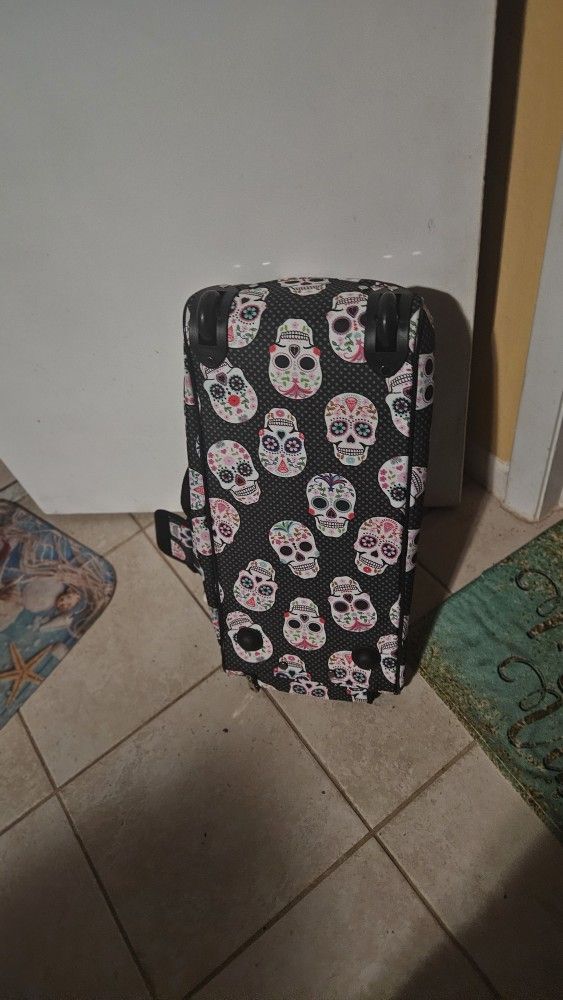 Betsy Johnson roll bag with skulls