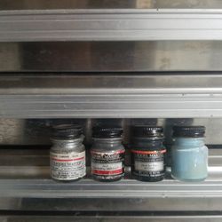 Around 400 Testors brand half oz jars of model paint 