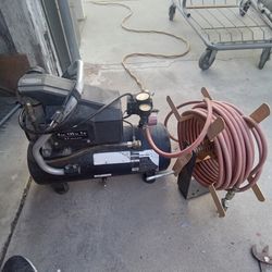 Air Compressor With Hose and Wall mount for  the Hose works Good  50 of Hose and Two Attachments
